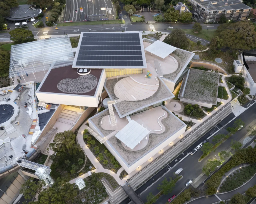 Aerial view of Sydney Modern art gallery extension showing interconnected glass pavilions by SANAA