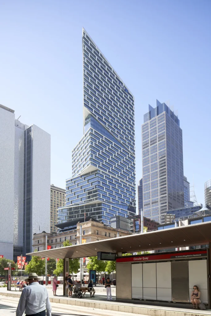 People waiting for tram at Circular Quay near Quay Quarter Tower in Sydney CBD