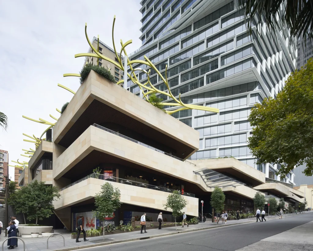 Yellow ribbon sculpture on the landscaped terraces of Quay Quarter Tower
